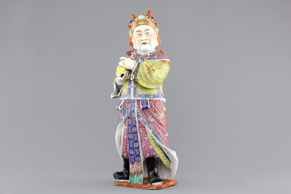 A tall Chinese famille rose porcelain figure of a dignitary, 19th C.