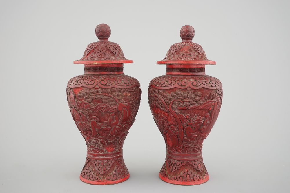 A pair of Chinese carved cinnabar lacquer vases and covers, 18/19th C