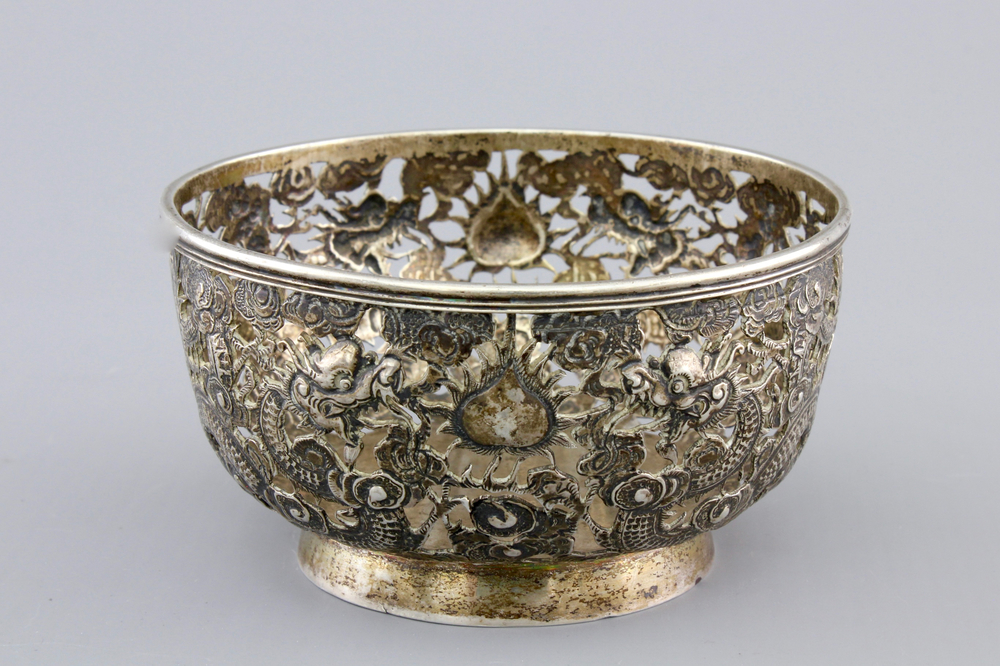 An open-worked Chinese silver dragon bowl, Wang Hing, China, 19th C.