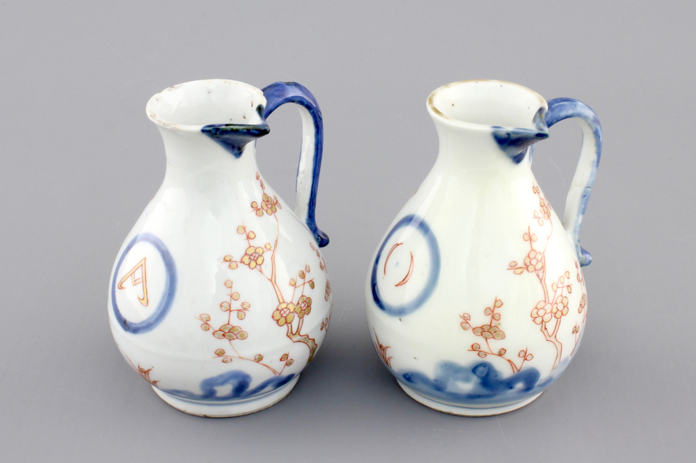 A pair of Japanese Arita porcelain oil and vinegar jugs, 18th C.