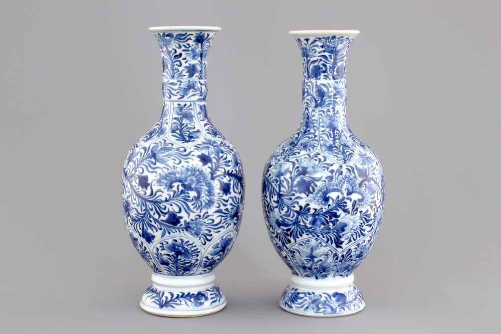 A pair of Chinese porcelain blue and white flower scroll vases, Kangxi, ca. 1700