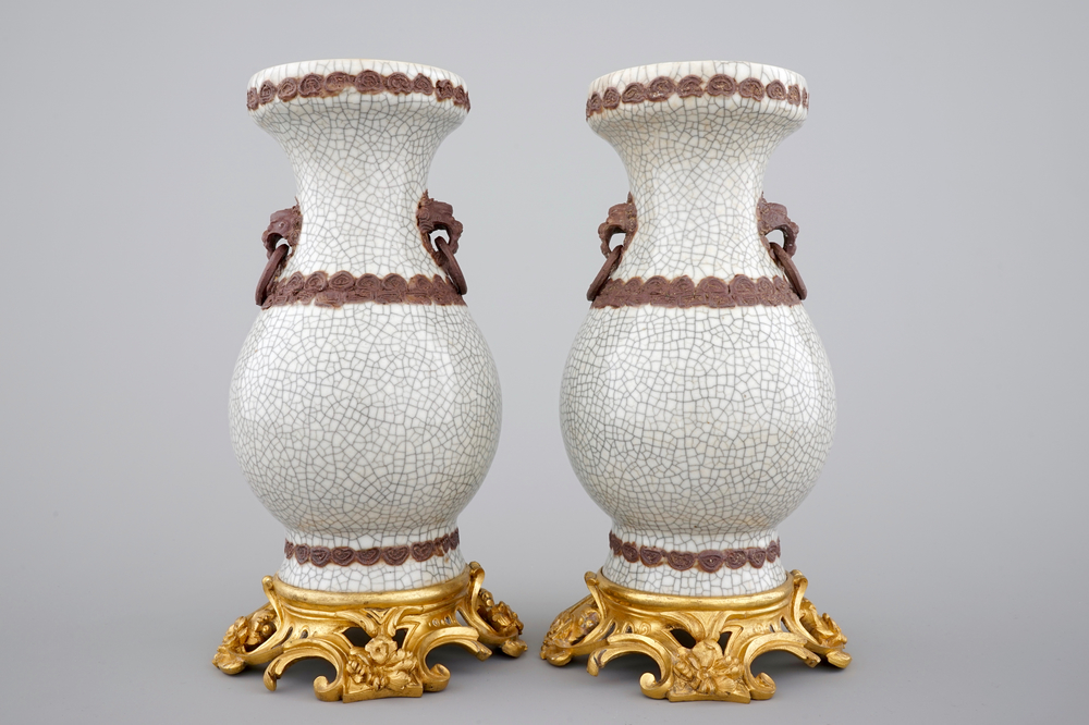 A pair of Chinese crackle glaze vases on bronze mounts, 19th C.