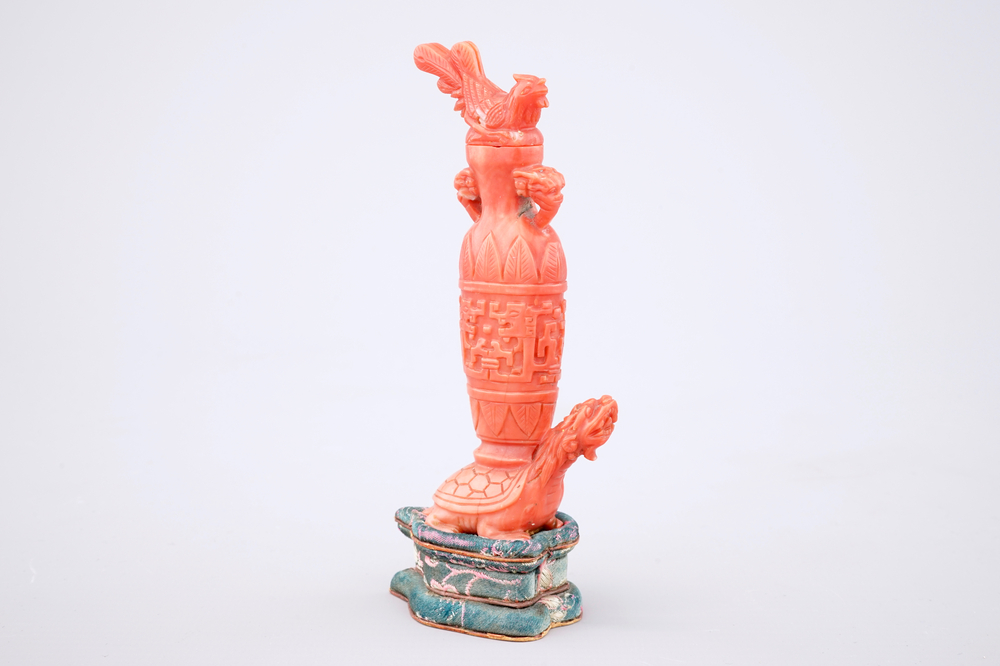 A Chinese carved red coral turtle snuff bottle on stand, 19th C.