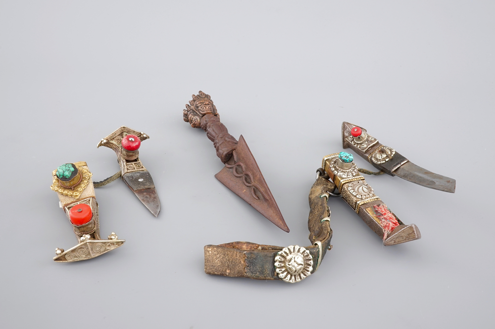 A Tibetan iron Purbu, 13/14th C. and two knives in silver and semi-precious stones, 19/20th C.