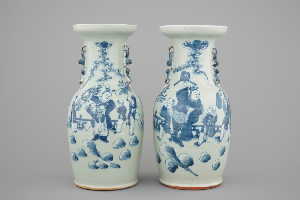 A pair of blue and white Chinese vases on celadon ground with playing boys 19th C.