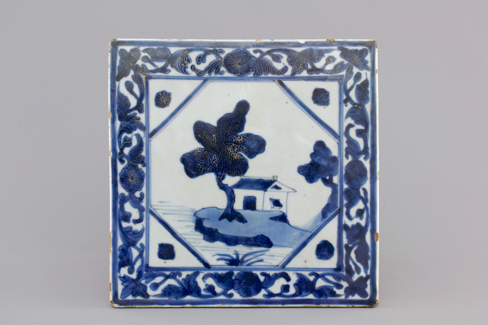 A Chinese blue, white and gilt porcelain landscape tile, 19th C.