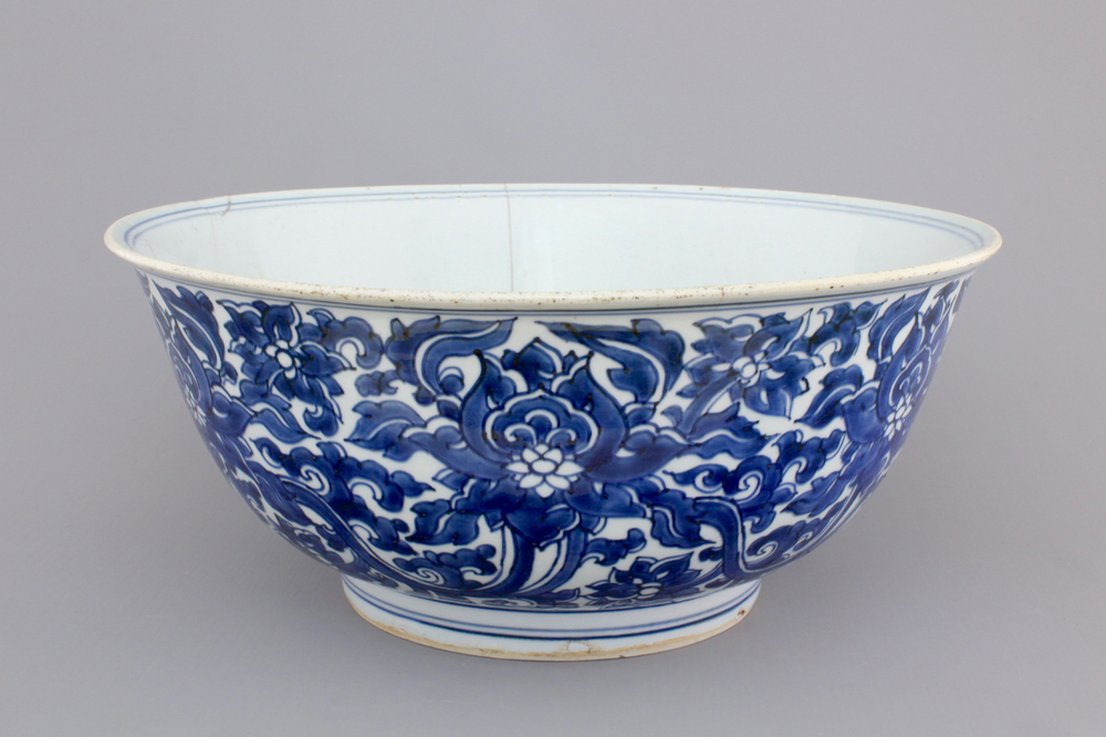 A large blue and white Chinese porcelain bowl with lotus scrolls, Kangxi, ca. 1680