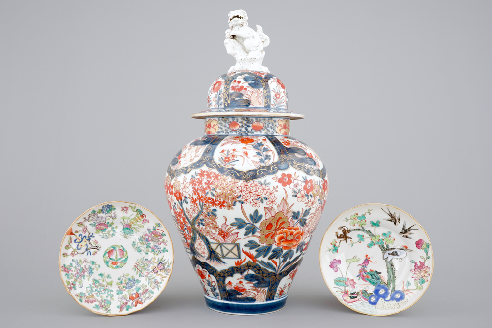A tall Japanese Imari vase, 17/18th C. and two Chinese famille rose plates, 19th C.