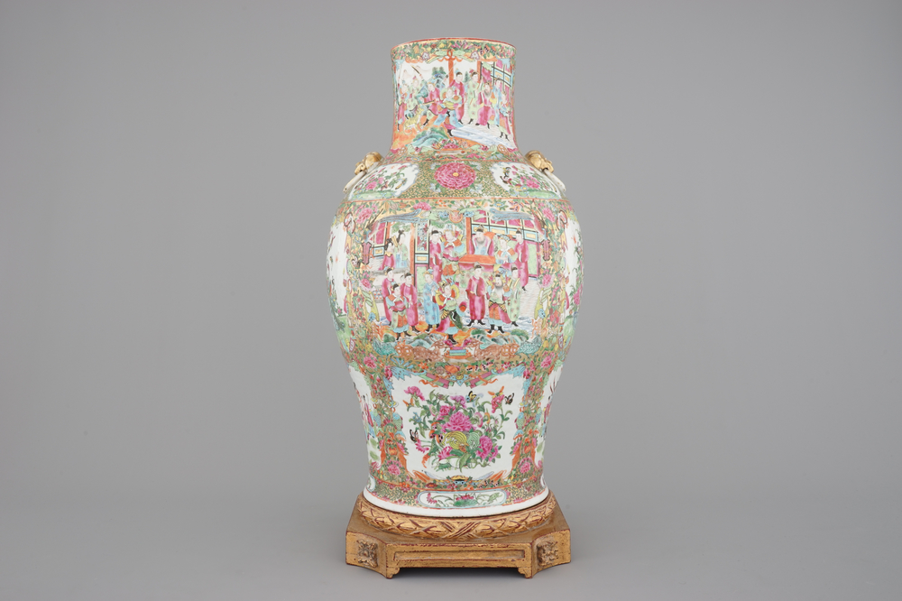 A tall Chinese Canton rose medallion porcelain vase on gilt wood stand, 19th C.