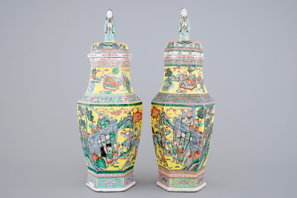 A pair of rare hexagonal Chinese famille jaune porcelain vases with figural covers, 19th C.