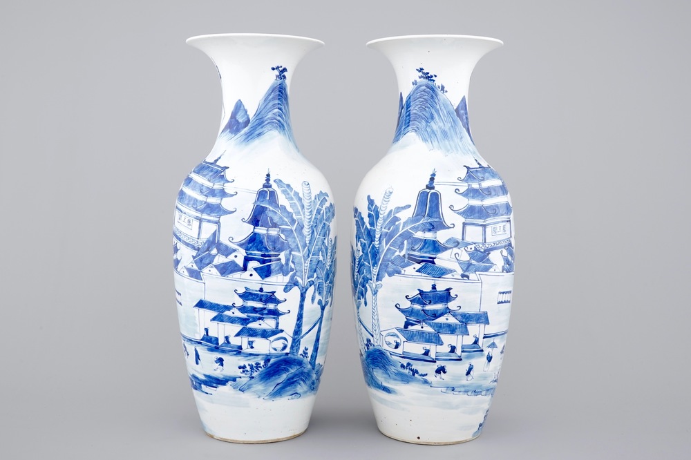 A tall pair of blue and white Chinese porcelain vases, 19th C.