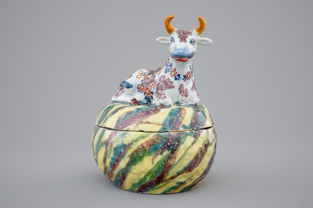 A polychrome Dutch Delftware butter tub with a cow, 18th C.