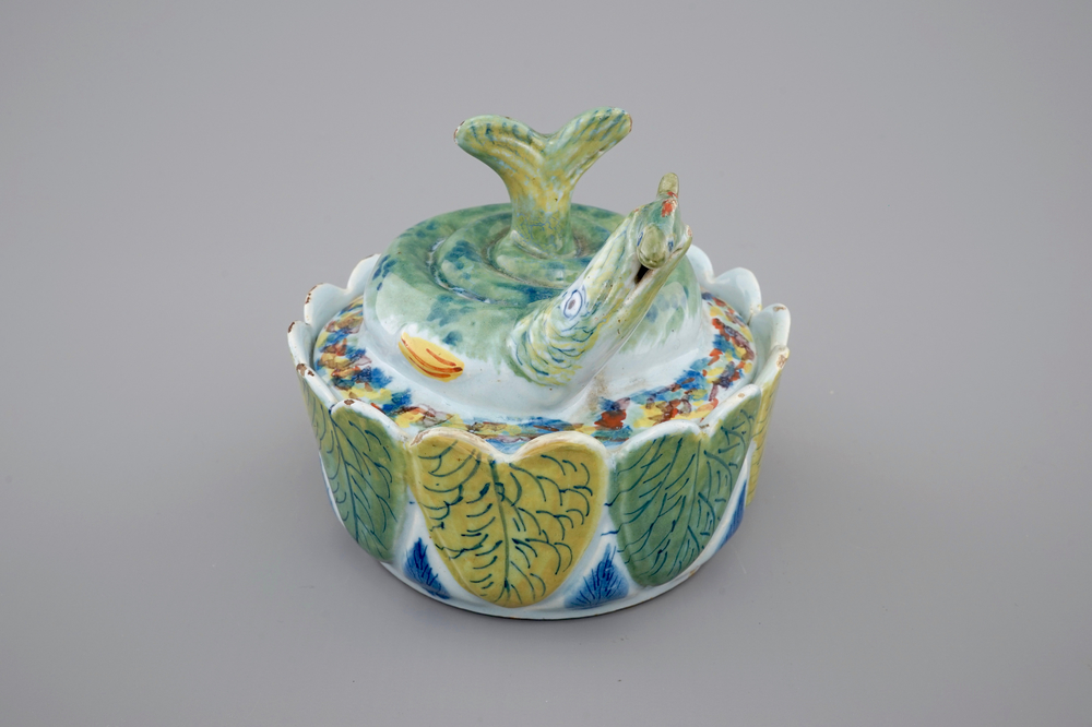 A Dutch Delft polychrome butter tub in the form of a pike, 18th C.