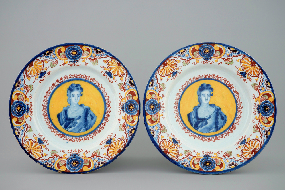 A pair of polychrome Dutch Delft yellow ground portrait plates, 18th C.