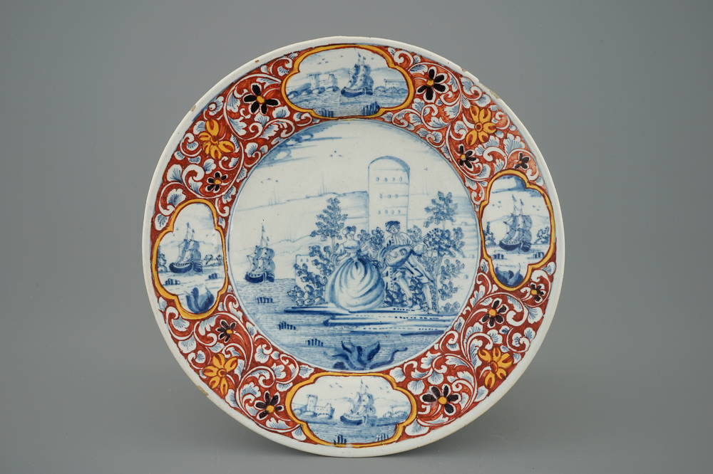 A Dutch Delft mixed technique plate with a pastoral scene, 18th C.