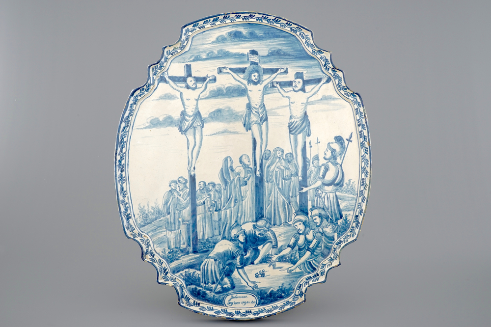 A large Dutch Delft blue and white Crucifixion plaque, Rotterdam, 18th C.