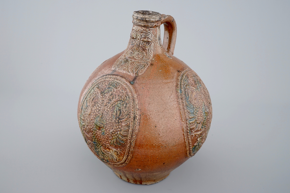 A rare Frechen bellarmine jug with double eagle seals, dated 1604