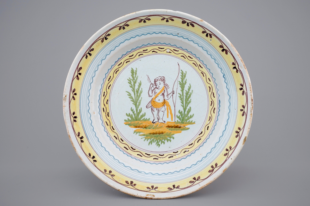 A Brussels faience plate with Cupid with bow and arrows, ca. 1780