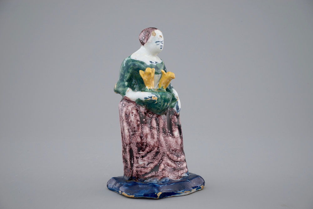 A Dutch Delft polychrome figure of a lady, 18th C.