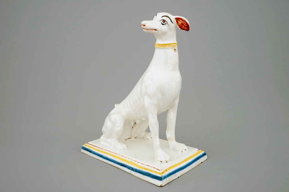 A tall polychrome Brussels faience model of a sighthound, 18th C.