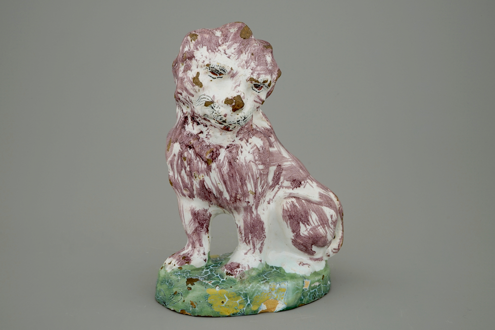 A tall polychrome Brussels faience model of a dog, 18th C.