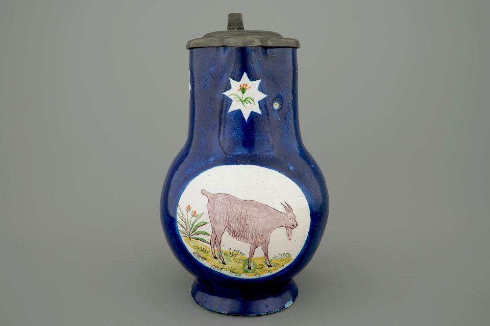 A Brussels faience pewter-mounted jug with a goat, 18th C.