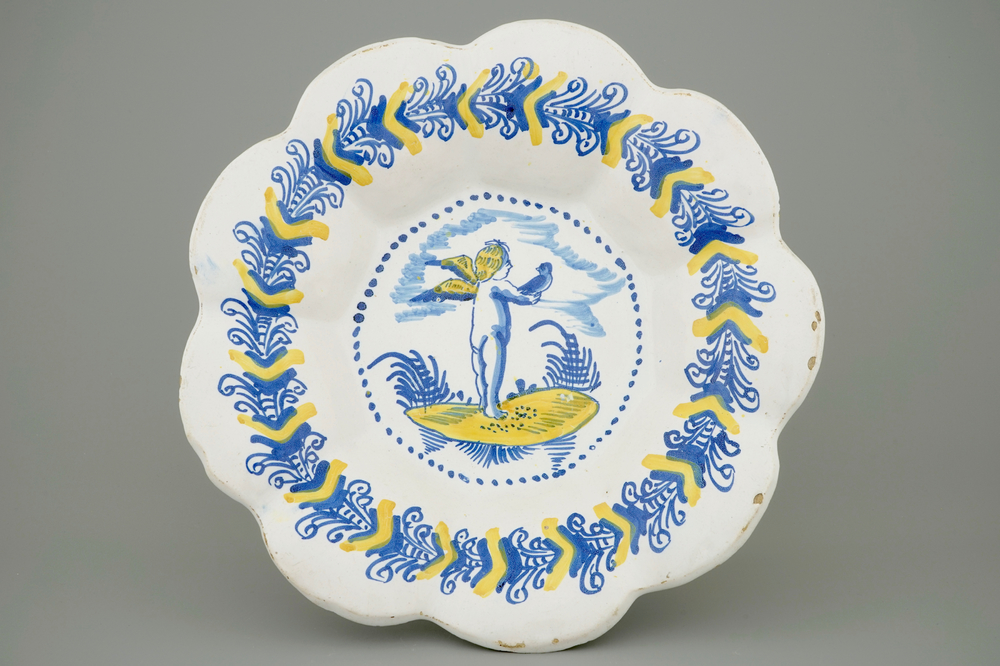 A Haarlem gadrooned dish with a putto as falconer, 17th C.