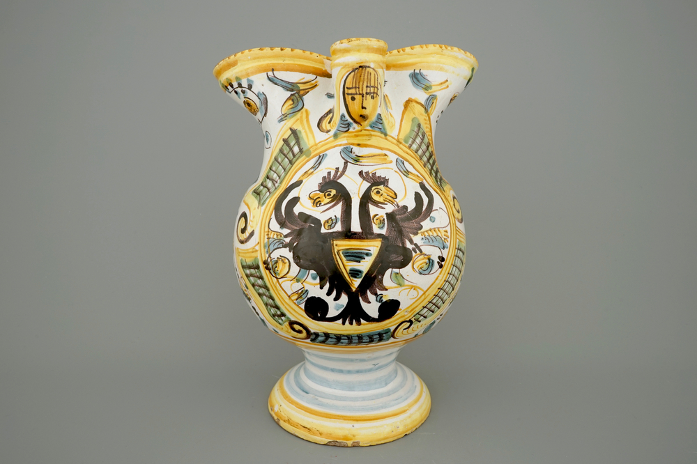 An Italian maiolica armorial jug with double eagle crest, Pesaro, 18th C.