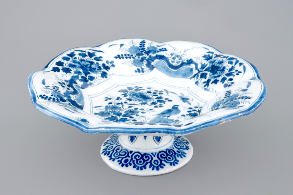 A Dutch Delft blue and white lobed chinoiserie dish on foot, late 17th C.