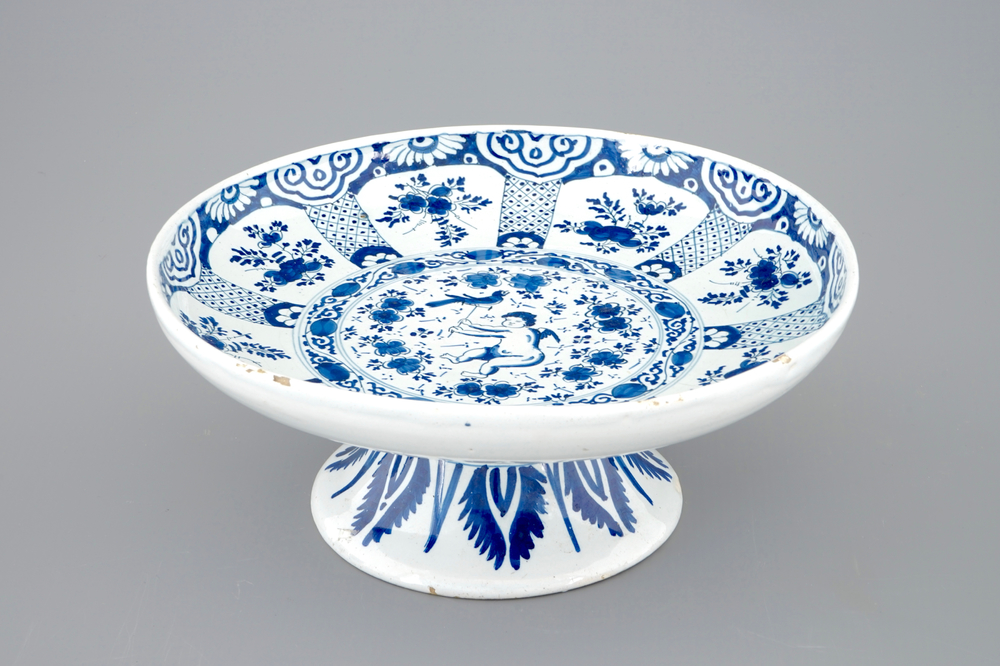 A blue and white Dutch Delft tazza with a putto as falconer, 18th C.
