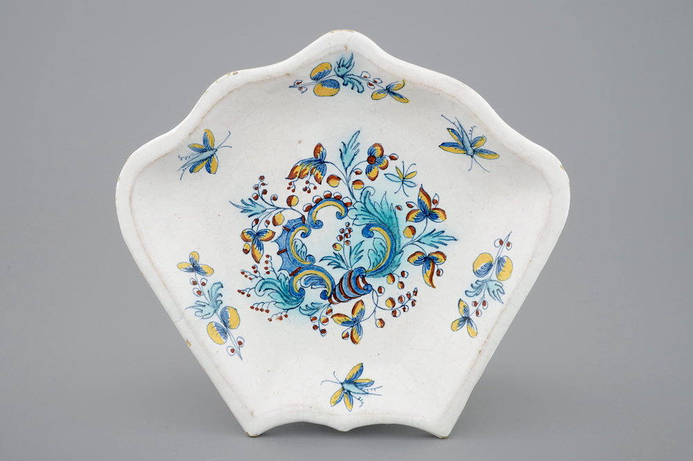 A Brussels faience plate, part of a rice table dish, 18th C.
