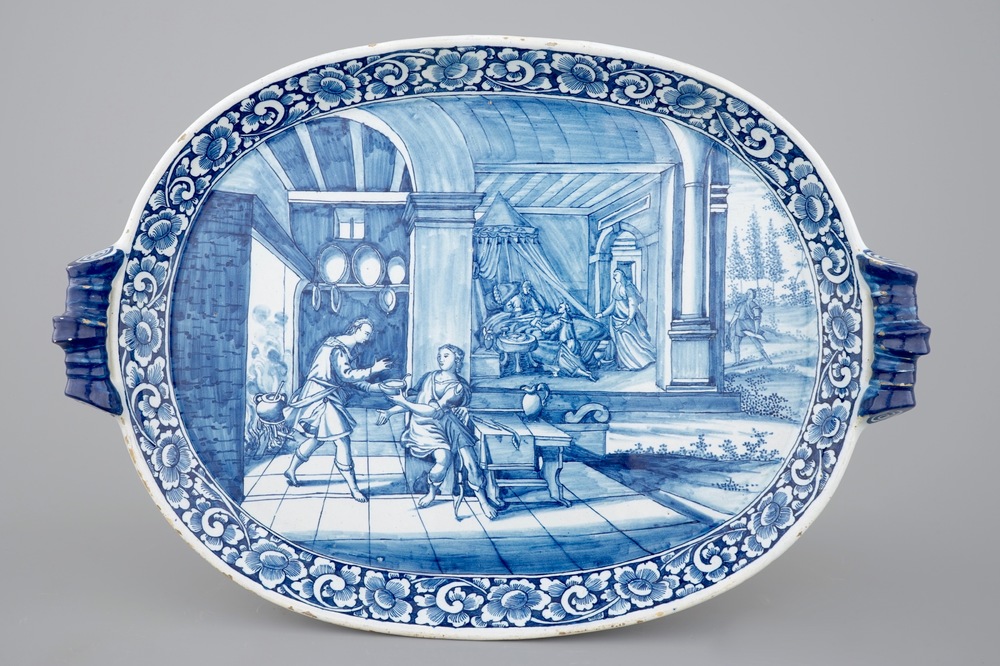 An oval blue and white Dutch Delft serving tray with a biblical scene, 18th C.