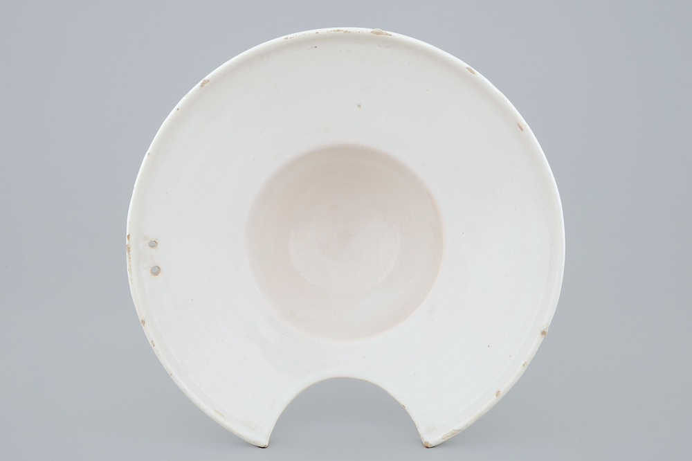 A white Dutch Delft shaving bowl, late 18th C.