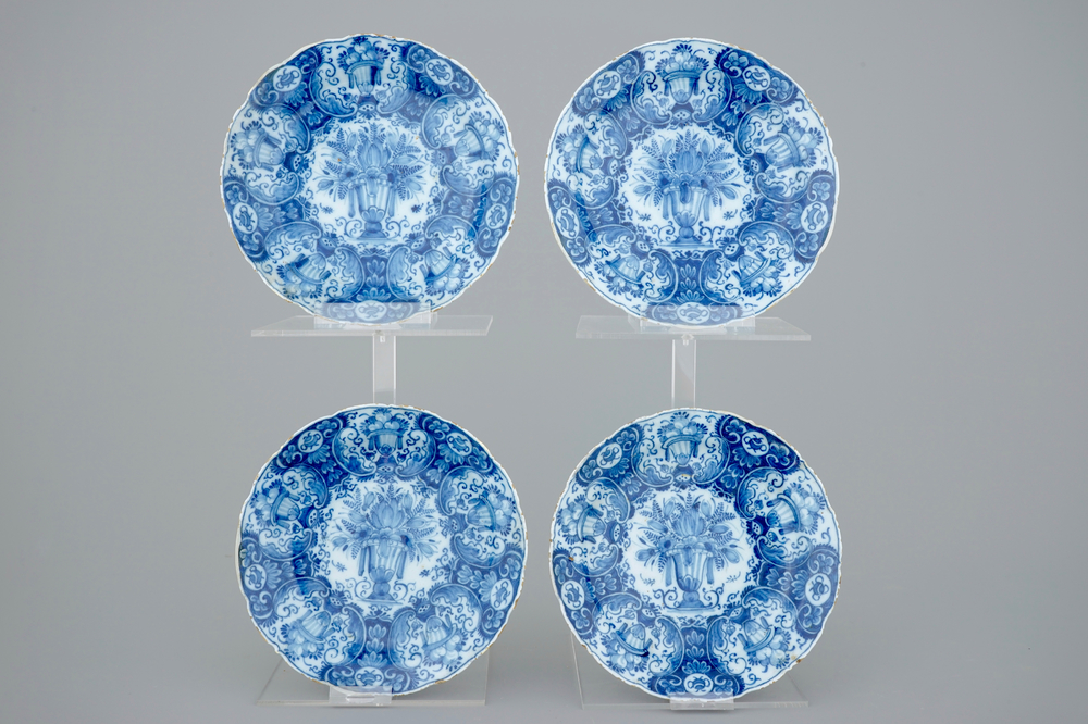 A set of 4 Dutch Delft blue and white plates with flower vases, 18th C.