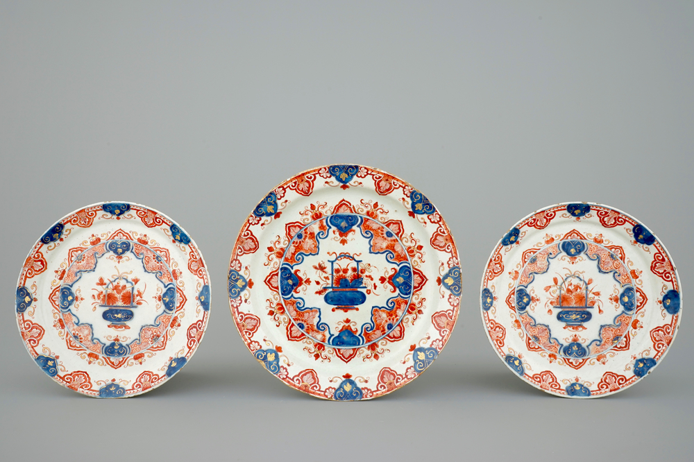 A set of three Dutch Delft dor&eacute; plates with flower baskets, 18th C.