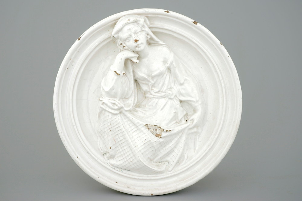 An Italian white glazed pottery relief medallion after Della Robbia, 17th C.