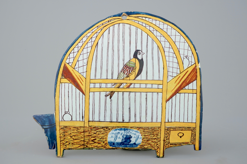 A polychrome Dutch Delft bird cage plaque, 18th C.