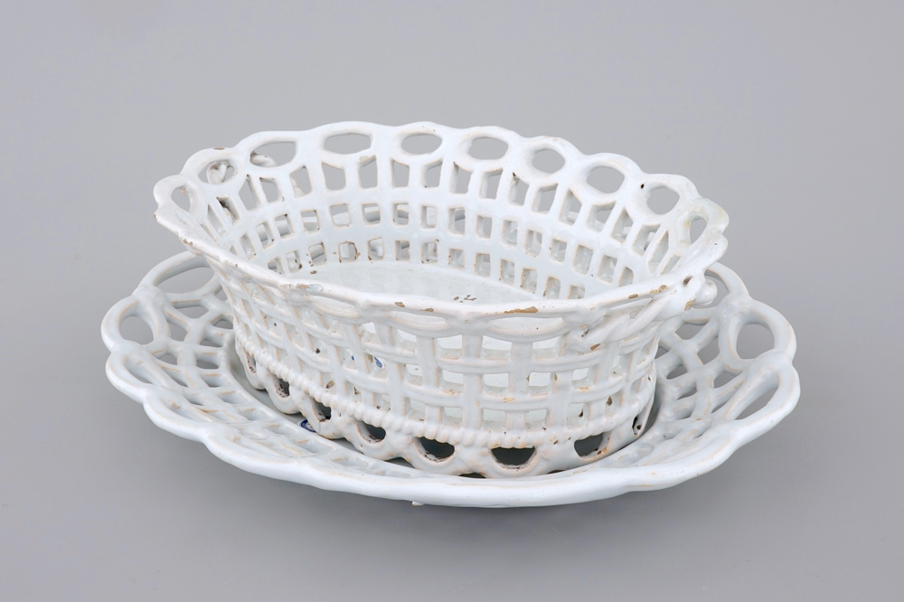 A white monochrome Brussels faience open-worked basket on stand, 18th C.