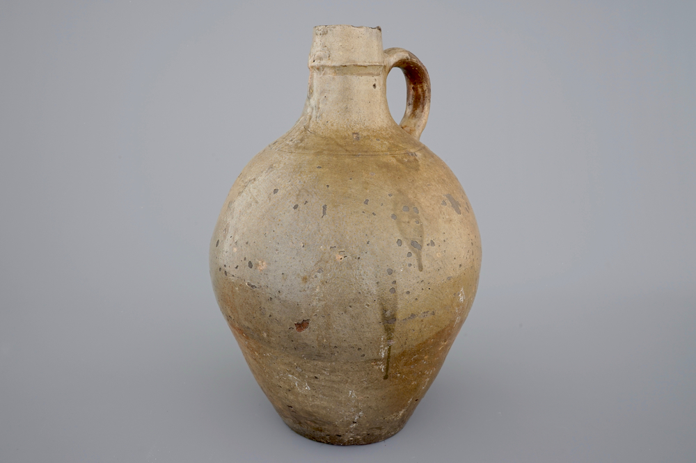 A tall stoneware bellarmine face jug, 17/18th C.