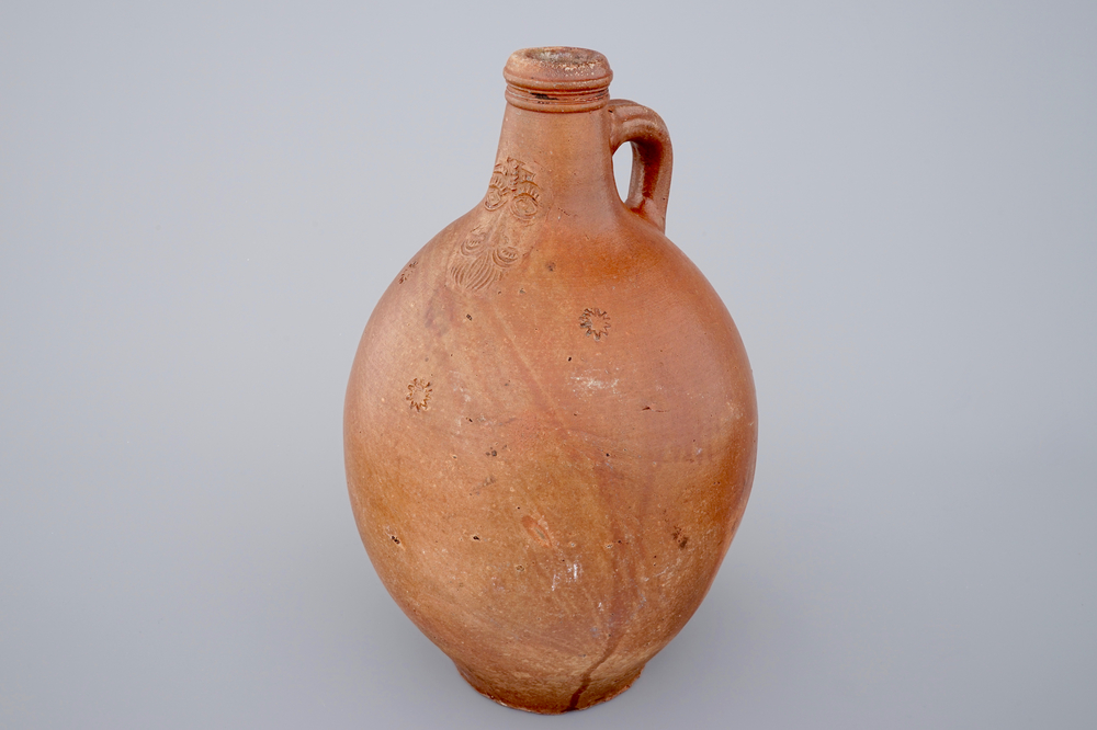 A large brown-glazed stoneware bellarmine jug, 18th C.