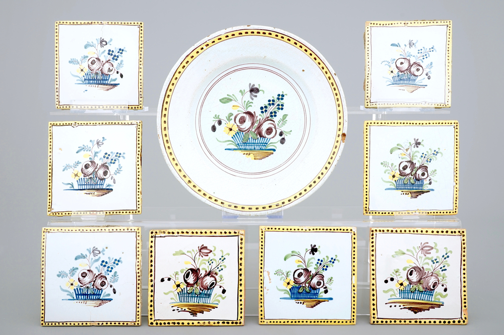 A set of 8 tiles and a plate with flowers, 18th C., Courtrai or Brussels