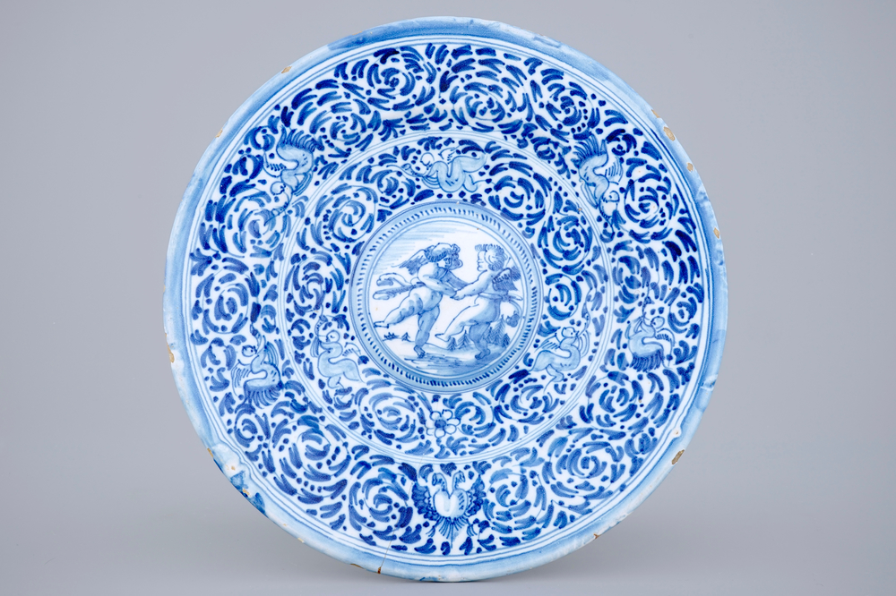 A blue and white cardinals dish with putti, Delft or Haarlem, 17th C.