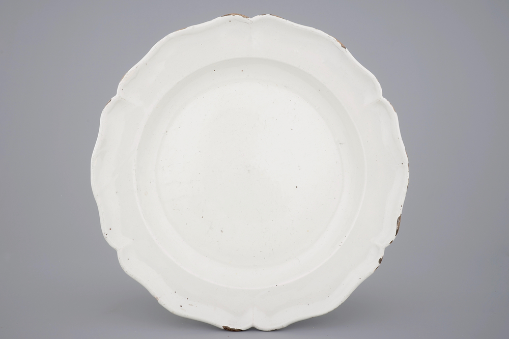 A large white monochrome Delftware dish with lobed edge, 18th C.