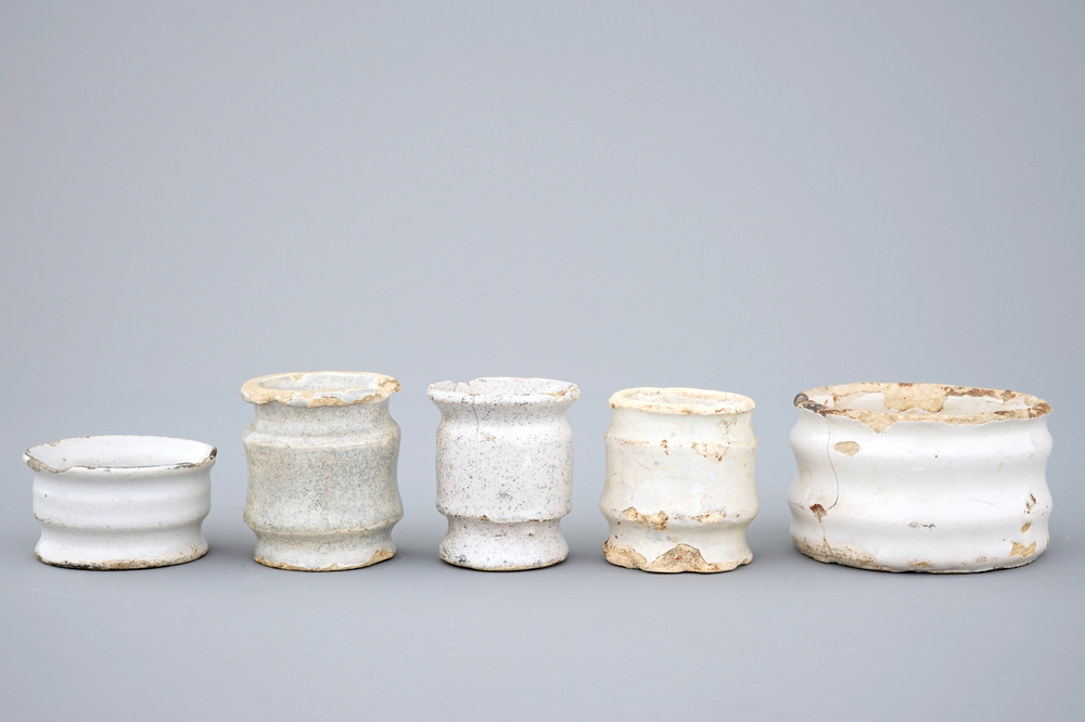 A set of five monochrome white Dutch Delft ointment jars, 17th C.