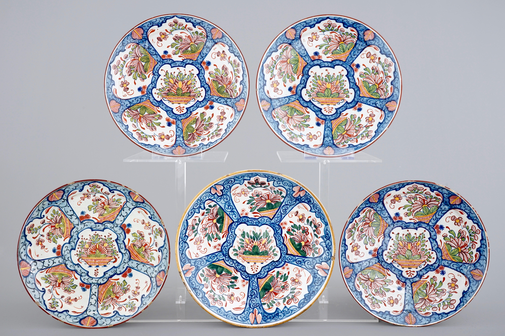 A set of five polychrome Dutch Delft plates with flower baskets, 18th C.