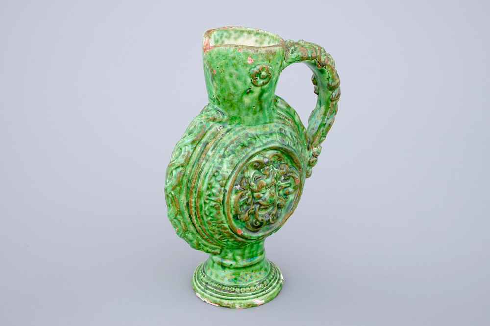 A green glazed Saintonge relief decorated jug, France, 17th C.
