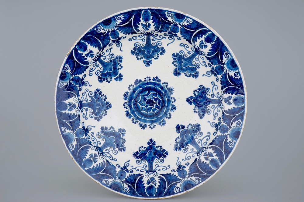 An exceptionally large Dutch Delft blue and white floral dish, 18th C.