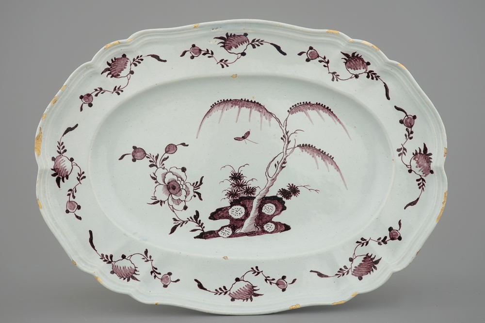 A large oval manganese Dutch Delft floral dish, 18th C.