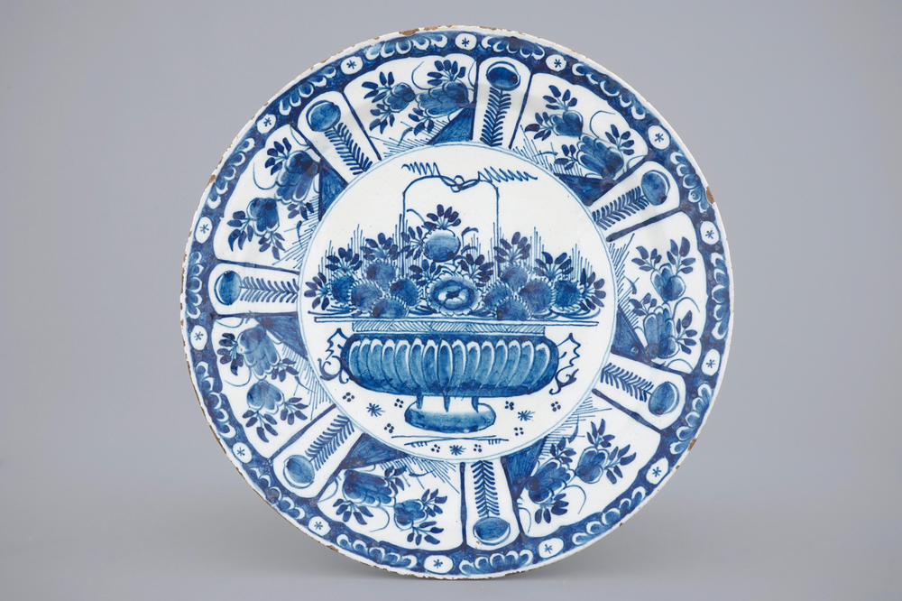 A blue and white Dutch Delft dish with a flower basket, early 18th C.