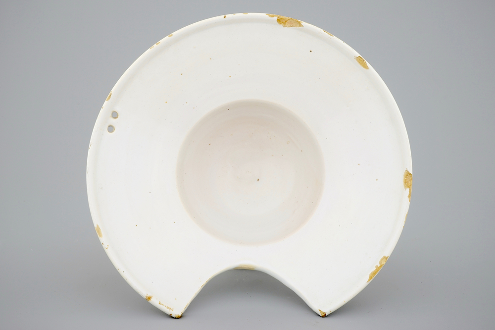 A white Dutch Delft shaving bowl, 18th C.